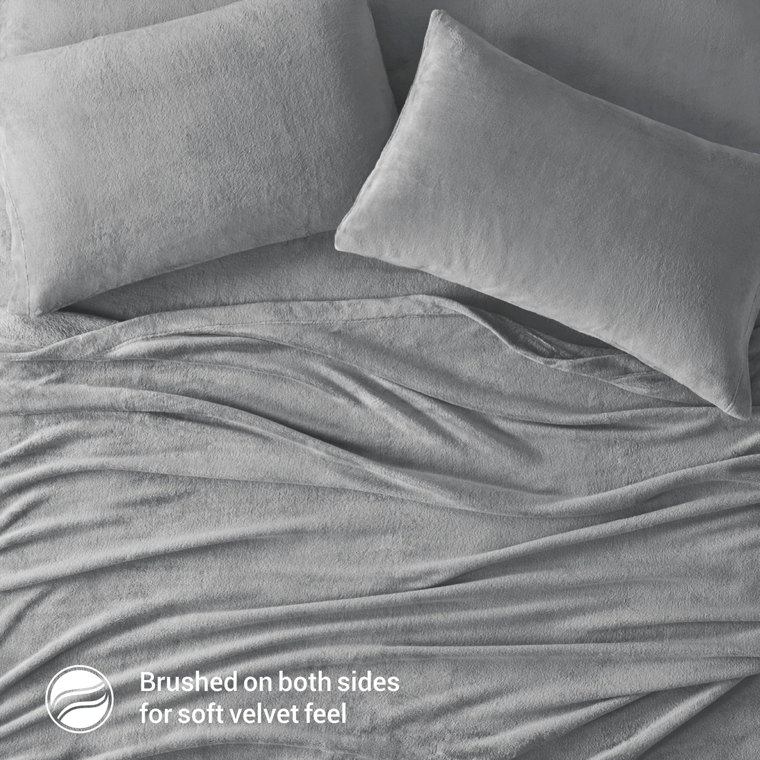 Drap‑housse True North élastique illustrant maintien sûr sur matelas