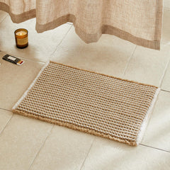 TYUU packaging avant du tapis de bain montrant le format et l'esthétique boho