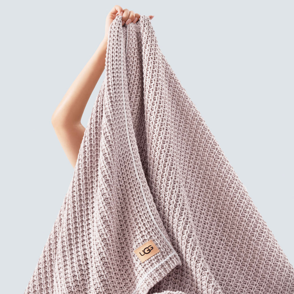 UGG plié montrant dimensions 127x177 cm, rangement facile