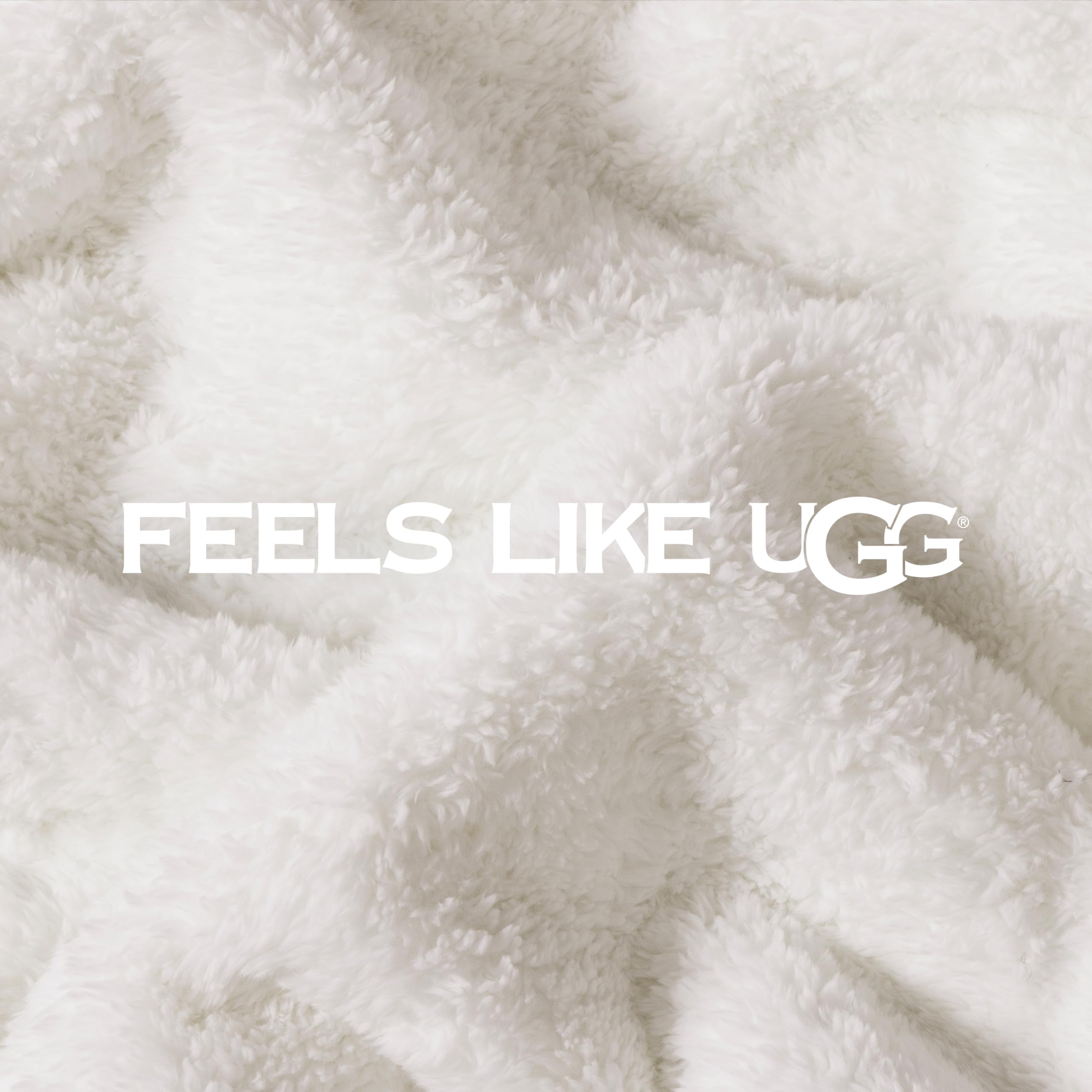 UGG Whitecap posé sur lit pour comparer taille 127x177 cm, couvre bien