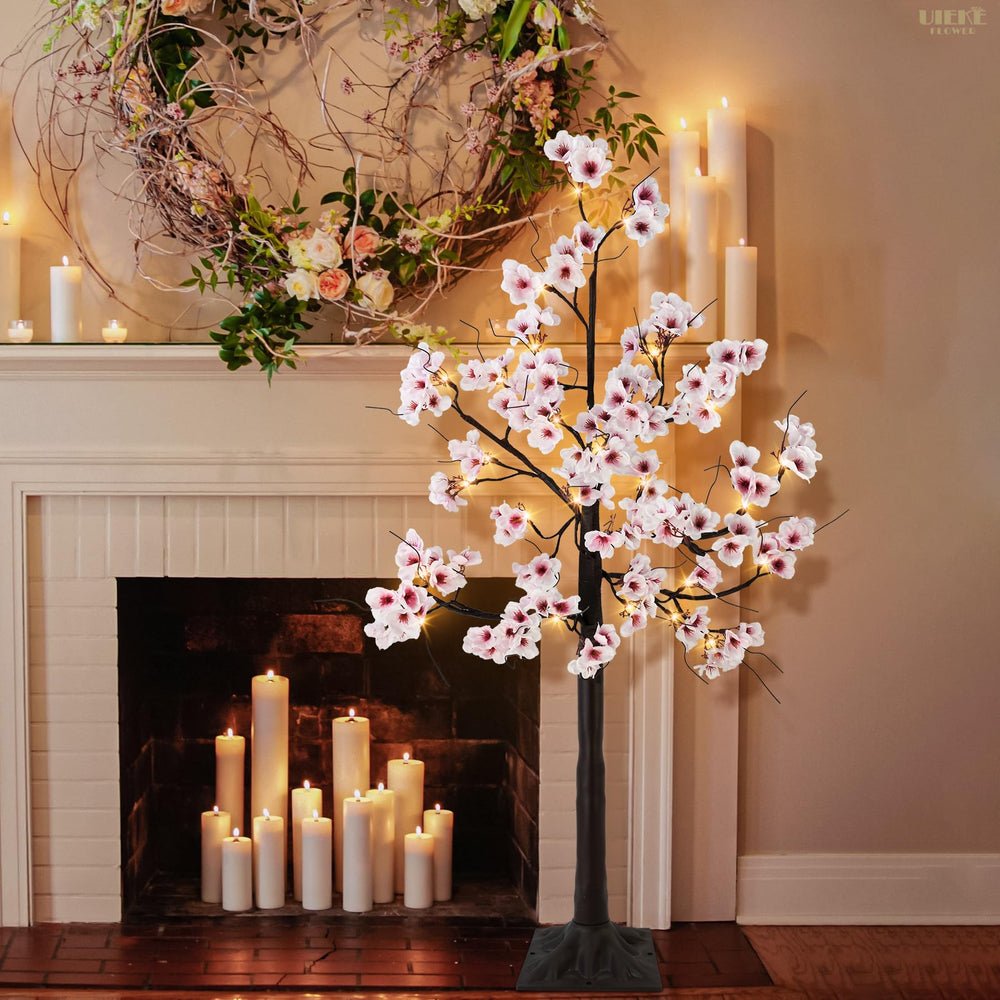 Uieke arbre en jardin avec piquets assurant stabilité en extérieur