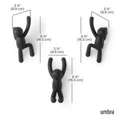Umbra Buddy installé dans une entrée accrochant manteau et sac, pratique