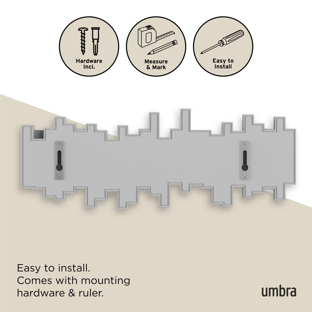 Umbra Sticks comparaison d'échelle montrant dimensions compactes et proportions
