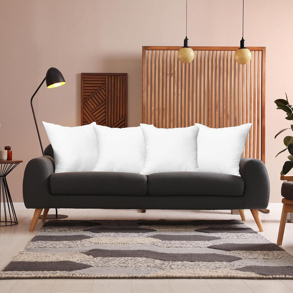 Utopia Bedding ensemble de quatre coussins posés sur un lit pour un look coordonné