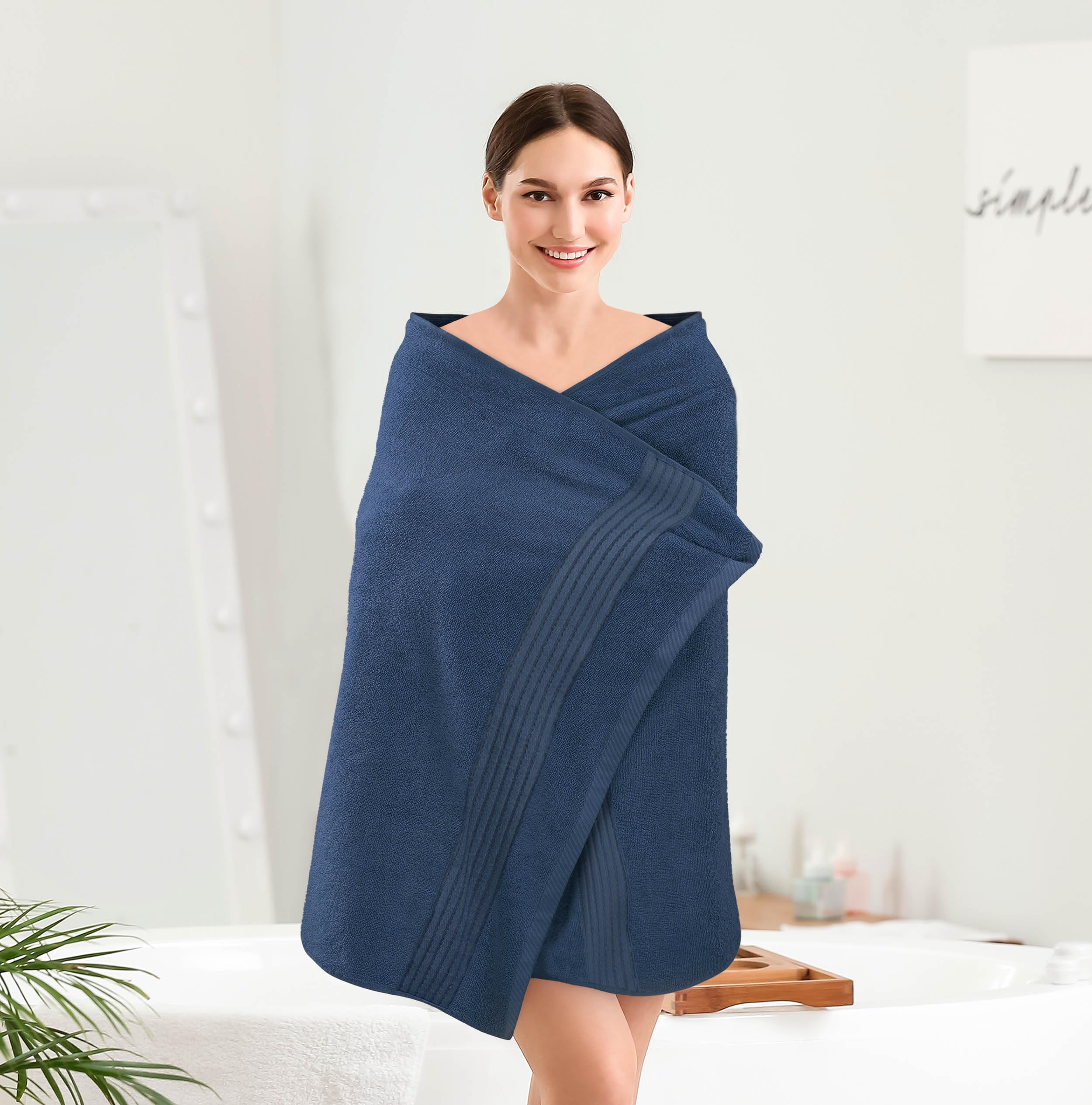 Utopia Towels comparaison de taille avec un mannequin montrant dimensions 27x54 pouces