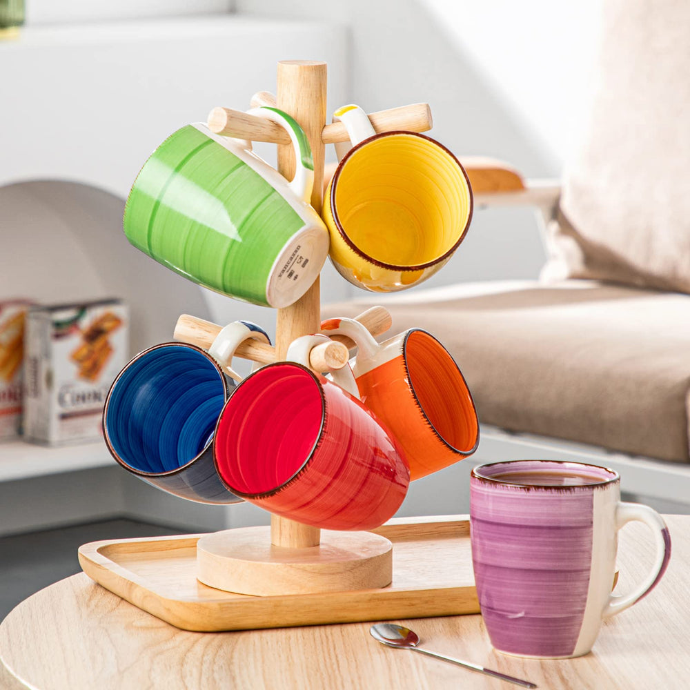 vancasso tasse à côté d'une cuillère pour comparaison de taille utile
