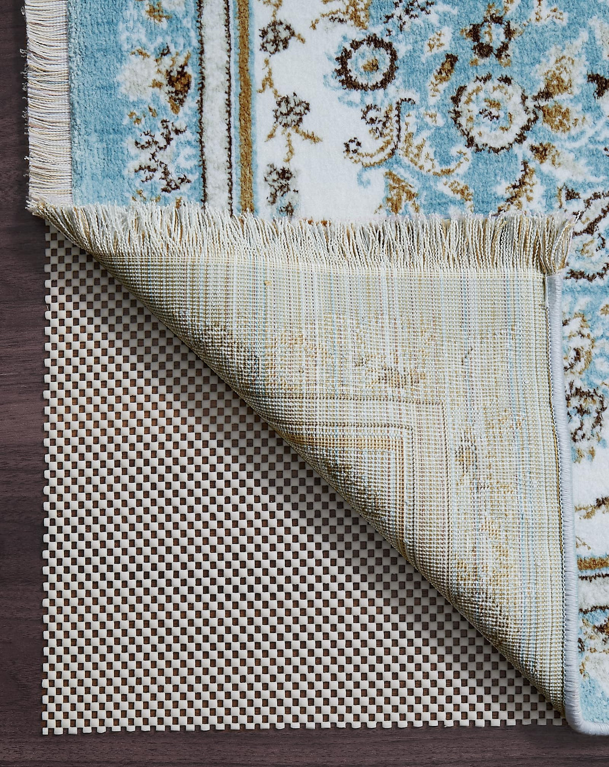 Veken packaging avant montrant le sous-tapis 7x9 et ses bénéfices antidérapants