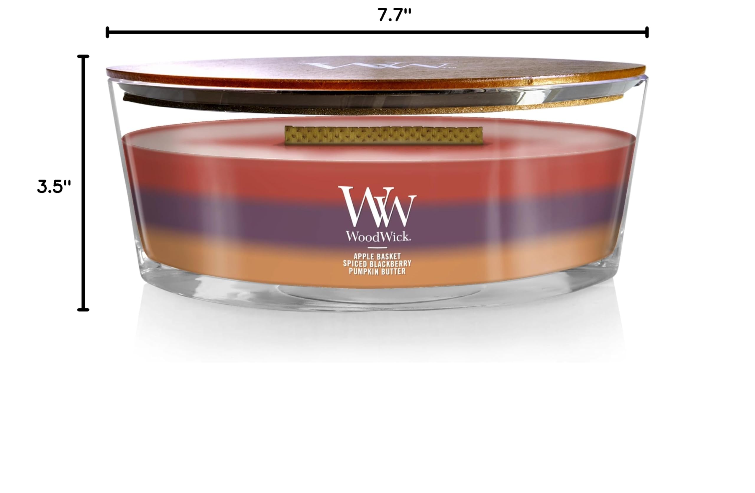 WoodWick bougie 16 oz à côté d’un objet pour comparaison d’échelle pratique