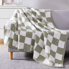 WRENSONGE plaid posé sur lit créant ambiance cosy