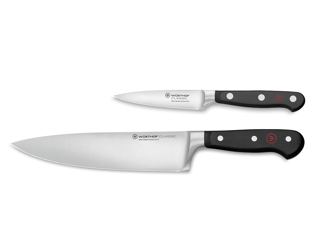 Wüsthof couteau chef face avant montrant la lame et la finition, coupe précise