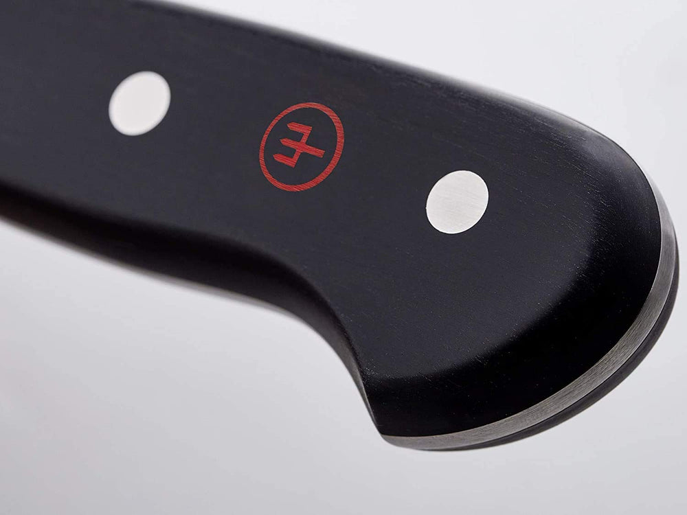 Wüsthof couteau en action découpant un rôti pour précision et régularité