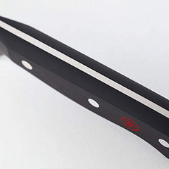 Wüsthof couteau en action sur planche, coupe fluide efficace