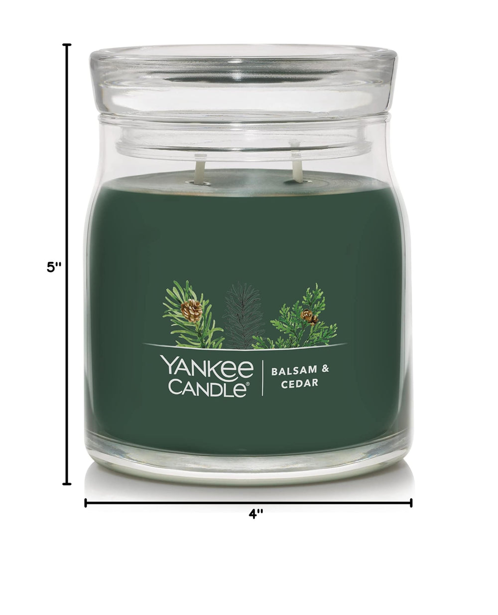 Yankee Candle mise en scène ambiance Noël évoquant chaleur et forêt