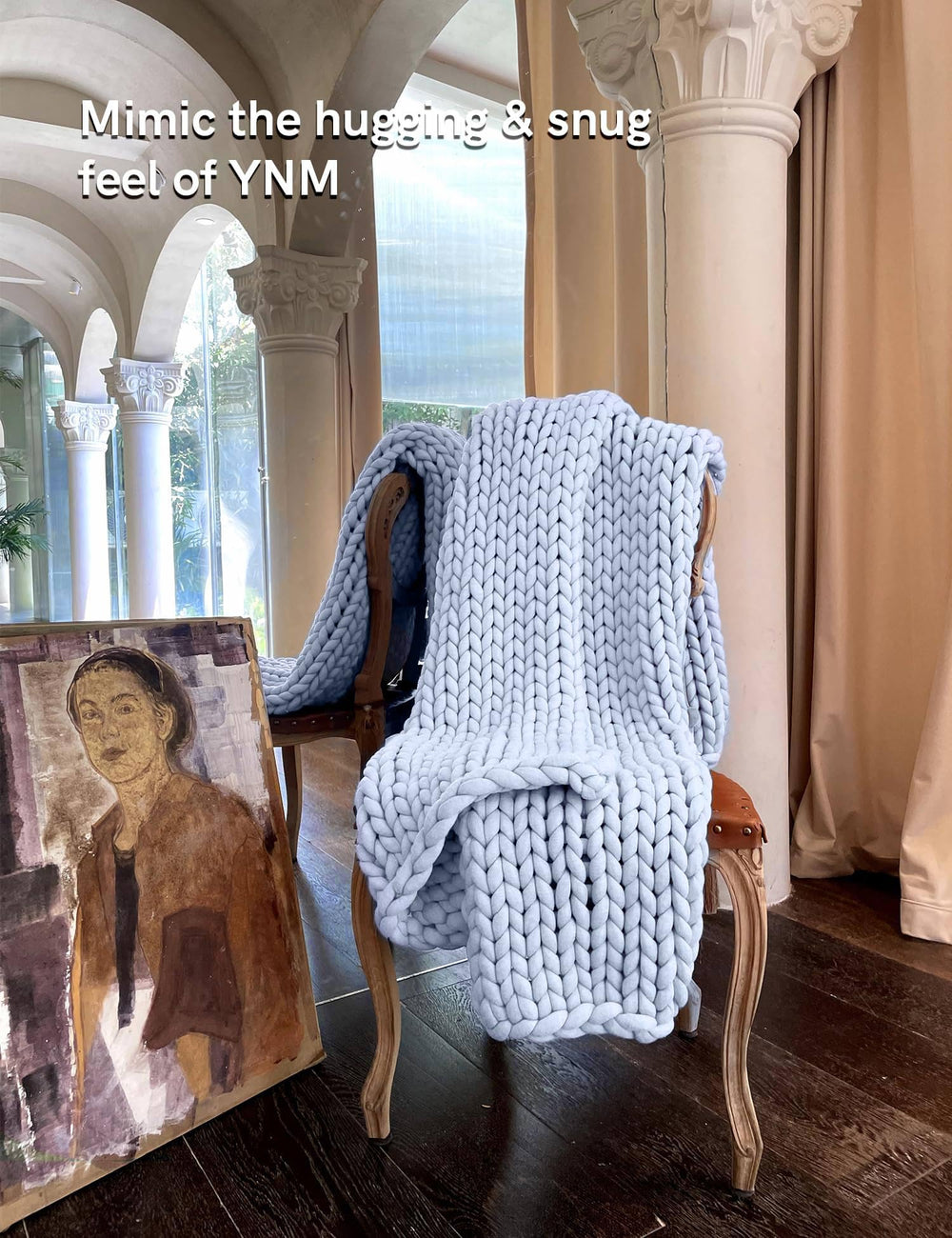 YnM plaid disposé sur lit montrant l'effet décoratif en chambre