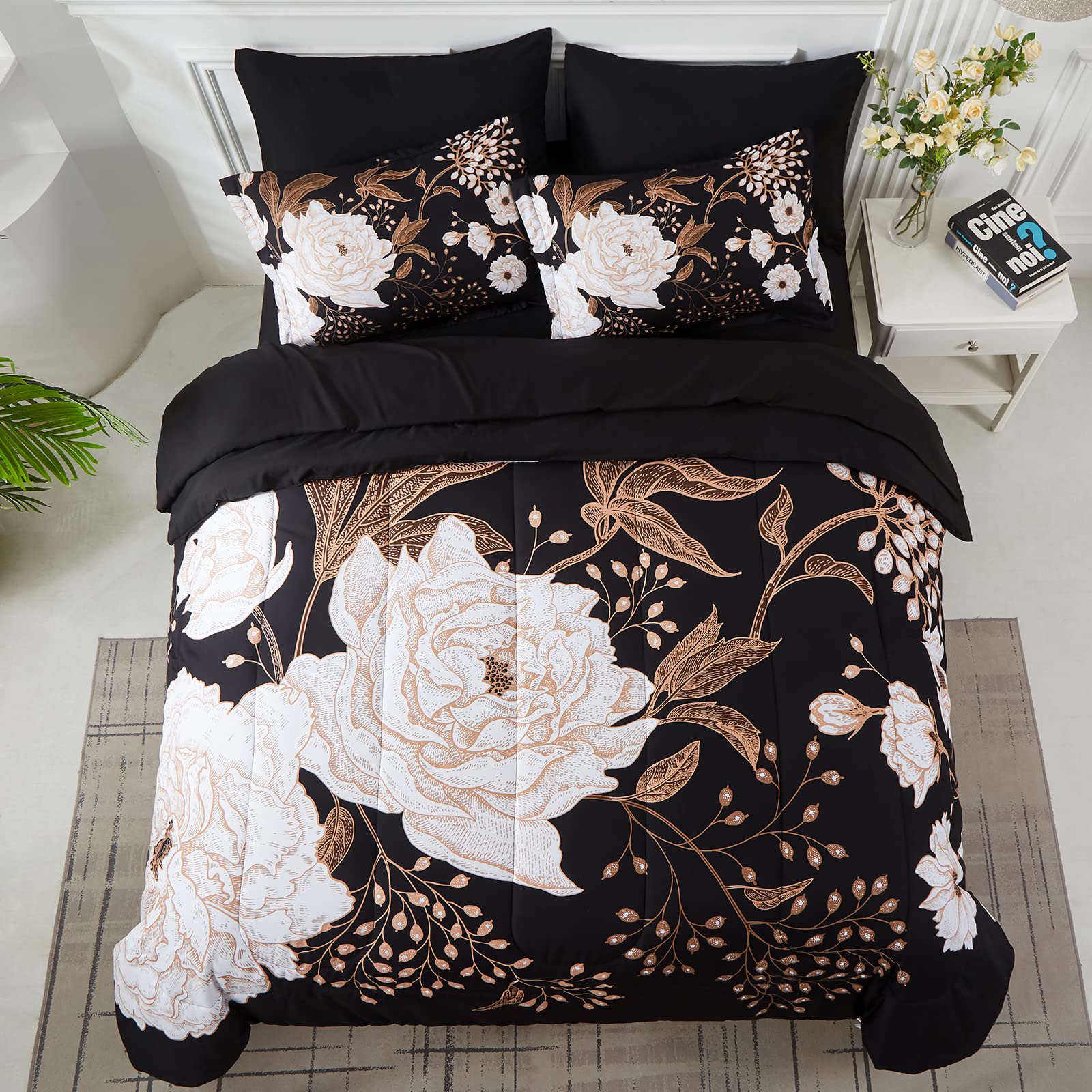Couette réversible Yogeneg affichant le motif floral blanc sur fond noir, change facilement l’ambiance