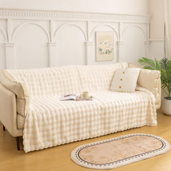 YUSOKI plaid sur canapé ajoutant chaleur décorative et style