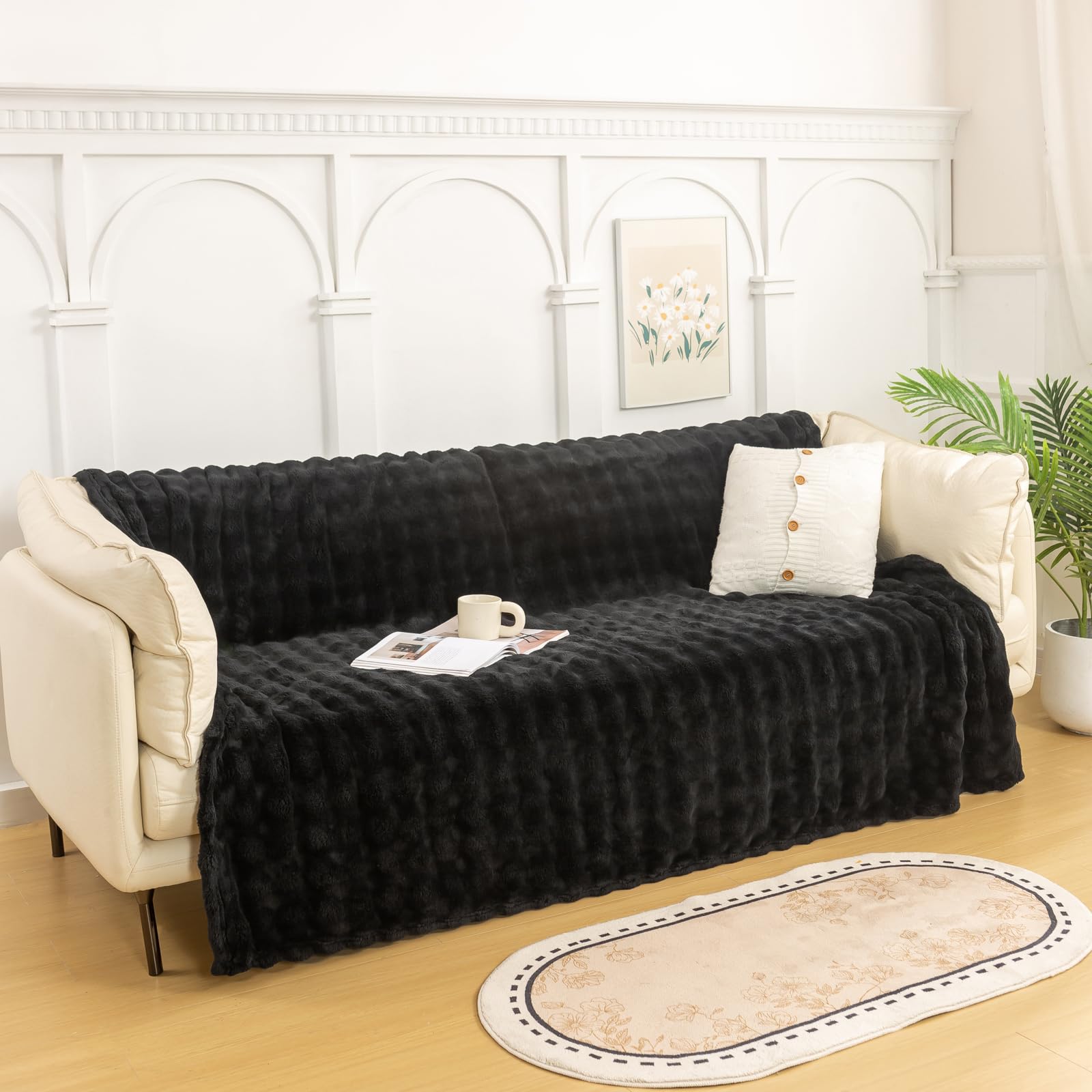 YUSOKI plaid sur canapé montrant ambiance cosy et stylée