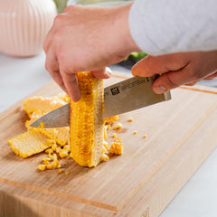 ZWILLING couteau en action coupant légumes pour gain de temps